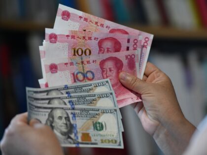 The US dollar and Chinese yuan are being seen in Fuyang City, Anhui Province, China, on June 23, 2023. (Photo by Costfoto/NurPhoto via Getty Images)