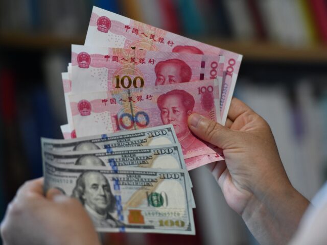 The US dollar and Chinese yuan are being seen in Fuyang City, Anhui Province, China, on Ju