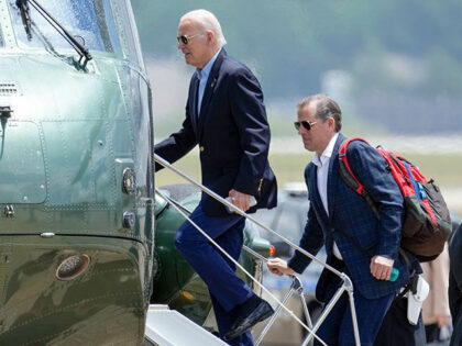 President Joe Biden boards Marine One with his son Hunter Biden as he leaves Andrews Air F