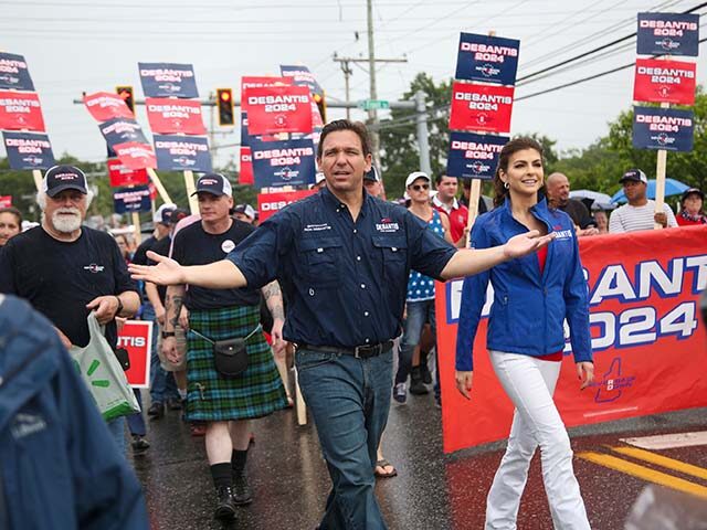 Republican presidential candidate and Florida Gov. Ron DeSantis and his wife Casey, walk i