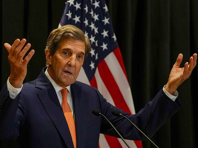 U.S. climate envoy John Kerry gestures as he speaks during a press conference following a