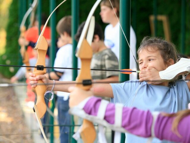Children Practicing Archery (Philippe Lissac/Getty Images)