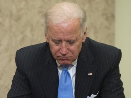 US Vice President Joe Biden prays during a dedication ceremony naming a Capitol Visitor Center conference room in honor of former Arizona Representative Gabrielle Giffords' slain aide Gabe Zimmerman at the US Capitol in Washington, DC, on April 16, 2013. Zimmerman was killed in the January 2011 shooting that left …