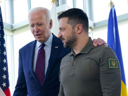 President Joe Biden, left, walks with Ukrainian President Volodymyr Zelenskyy ahead of a w