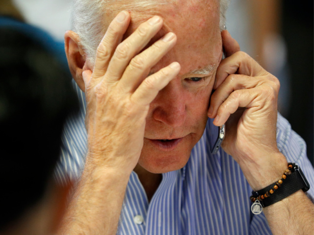 Former Vice President and Democratic presidential candidate Joe Biden calls during a campaign phone bank event an electrical workers union hall Saturday, July 20, 2019, in Las Vegas. (AP Photo/John Locher)