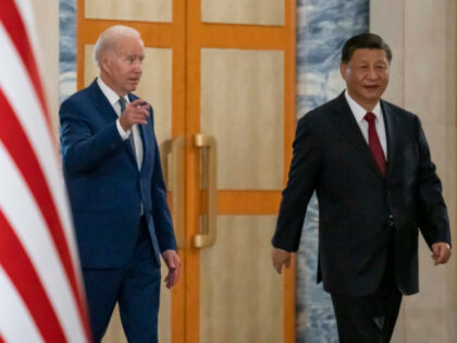 U.S. President Joe Biden, left, arrives with Chinese President Xi Jinping for a meeting on