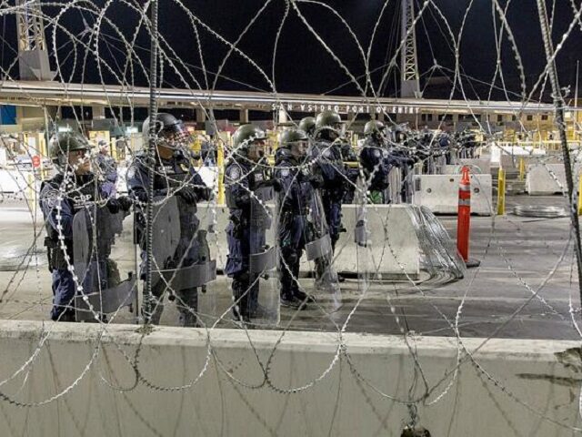 CBP officers stand by to repel illegal border crossers at a port of entry. (U.S. Customs a