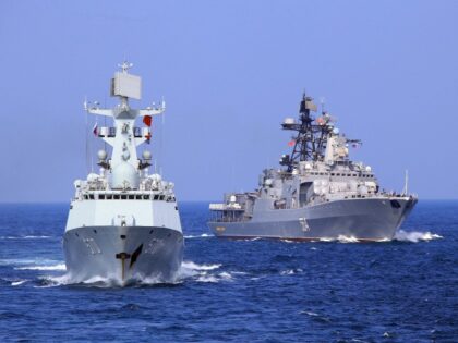 ONBOARD GUANGZHOU, Sept. 16, 2016 -- Chinese frigate "Huangshan" and Russian Navy's Antisubmarine Ship "Admiral Tributs" sail to a target area during a China-Russia naval joint drill at sea off south China's Guangdong Province, Sept. 16, 2016. Chinese and Russian fleets conducted joint operation exercise off Guangdong Province in the …