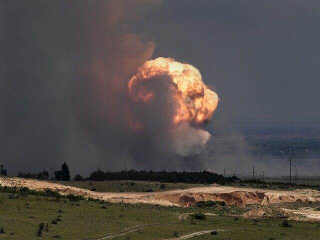 A picture shows detonation of ammunition caused by a fire at a military training field in