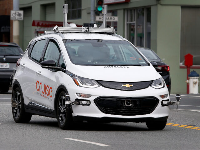 A self-driving car operated by Cruise rides on 11th Street in San Francisco, Calif. on Fri