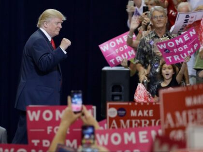 Republican presidential candidate Donald Trump takes the stage at a campaign rally Saturda