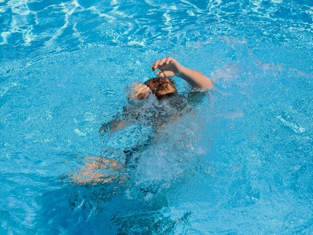 the child is drowning in the pool. drowning man. dangerous swimming. save a person. High q