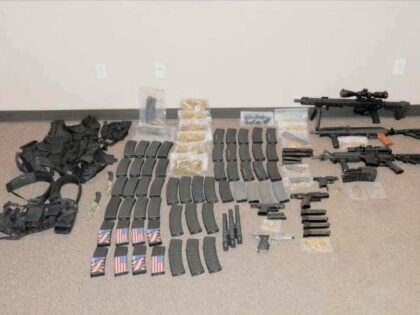 This photo released by the North Dakota Bureau of Criminal Investigation on Wednesday, July 19, 2023, shows the cache of weapons and ammunition that authorities recovered from the car of a man who opened fire on Fargo, N.D., police officers on Friday, July 14. One officer, Jake Wallin, was killed …