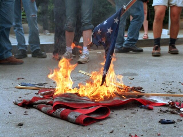 (FILES): This 20 April 2002 file photo shows demonstrators burning US flags in front of th