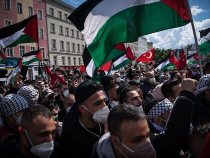 Demonstrators take part in a protest in solidarity with the Palestinians called over the ongoing conflict with Israel, on May 15, 2021 at the Hermannplatz in Berlin. - Palestinian militants have launched more than 1,800 rockets since Monday, according to Israel's army, which has launched hundreds of air strikes on …
