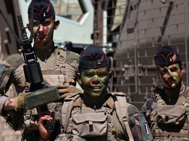 French naval soldiers pose as they take part in a demonstration at the Eurosatory internat