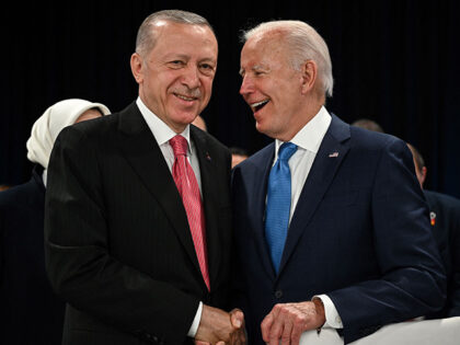 Turkey's President Recep Tayyip Erdogan (L) and US President Joe Biden shake hands at the start of the first plenary session of the NATO summit at the Ifema congress centre in Madrid, on June 29, 2022. (Photo by GABRIEL BOUYS / AFP) (Photo by GABRIEL BOUYS/AFP via Getty Images)