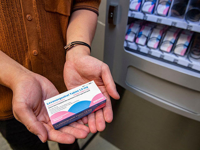 A person holds a carton of the "morning-after" pill purchased from the Plan-B ve