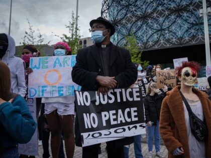 BIRMINGHAM, ENGLAND - JUNE 04: A man of the church takes part in a Black Lives Matter demo