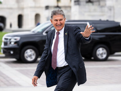 Sen. Joe Manchin, D-W. Va., waves to visitors on the Senate steps as he leaves the Capitol after the last vote of the week in Washington on Thurssday, May 4, 2023. (Bill Clark/CQ-Roll Call, Inc via Getty Images)