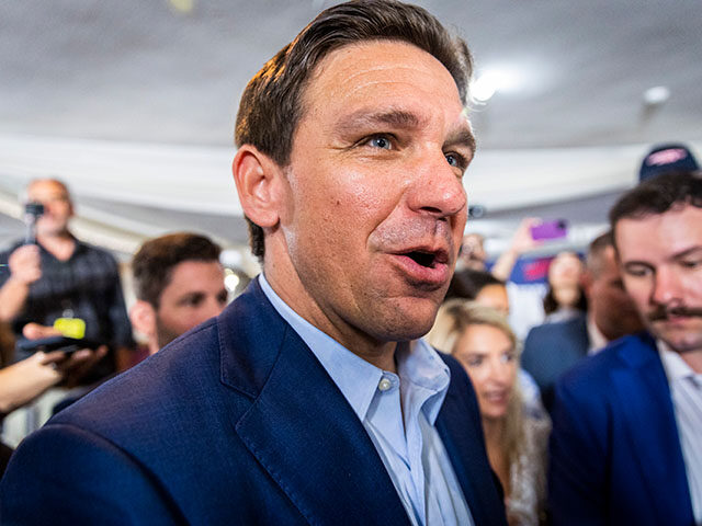 Republican presidential candidate Florida Governor Ron DeSantis greets guests during a tow
