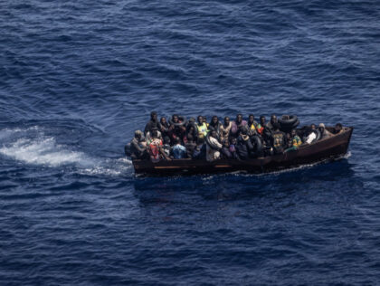 PRODUCTION - 29 June 2023, Italy, Lampedusa: Migrants steer a boat from the northern coast of Africa across the Mediterranean Sea towards the Italian island of Lampedusa. More and more African refugees are crossing to Italy from Tunisia. Many migrants pay a high price for the journey, and not only …