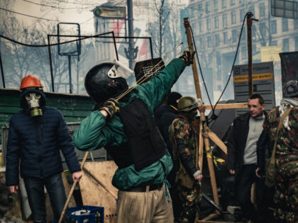 KYIV, UKRAINE - FEBRUARY 19: Protesters fighting government forces at barricades on Maidan