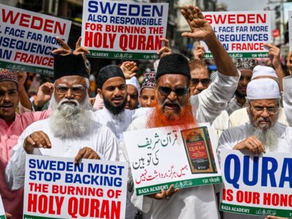Muslim activists display placards as they shout anti-Sweden slogans during a protest against the burning of a Koran outside a Stockholm mosque, in Mumbai on July 3, 2023. (Photo by Punit PARANJPE / AFP) (Photo by PUNIT PARANJPE/AFP via Getty Images)