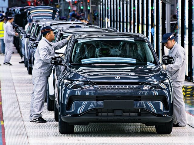 JINHUA, CHINA - APRIL 26: Employees work on the assembly line of C11 electric SUV at a fac