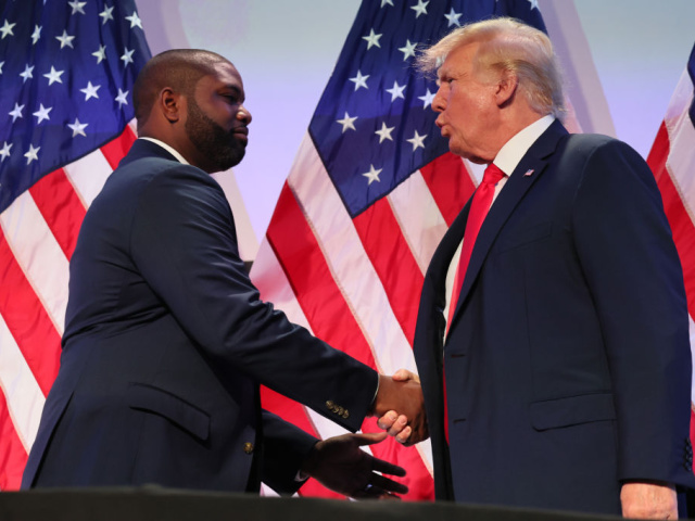 PHILADELPHIA, PENNSYLVANIA - JUNE 30: Rep. Byron Donalds (R-FL) shakes hands with former U.S. President Donald Trump during the Moms for Liberty Joyful Warriors national summit at the Philadelphia Marriott Downtown on June 30, 2023 in Philadelphia, Pennsylvania. The self-labeled "parental rights" summit is bringing school board hopefuls from across the country where attendees will receive training and hear from Republican presidential candidates which include former U.S. President Donald Trump, Florida Gov. Ron DeSantis and former South Carolina Gov. Nikki Haley. The summit, which is being held in an overwhelmingly Democratic Philadelphia, has drawn protestors since the event was announced due to their pushing of book bans accusing schools of ideological overreach, including teaching about race, gender, and sexuality. (Photo by Michael M. Santiago/Getty Images)