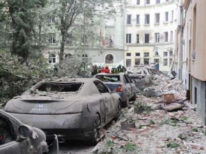 LVIV, UKRAINE - JULY 6: Rescue workers operate at the site of a missile strike on a four-s