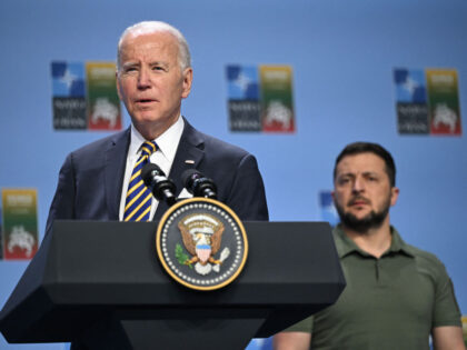 US President Joe Biden delivers a speech next to Ukrainian President Volodymyr Zelensky du