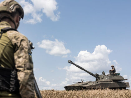 DONETSK OBLAST, UKRAINE - JULY 15: A Ukrainian soldier of the 72nd Brigade sits on a tank