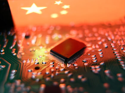Flag of China displayed on a phone screen and microchip and are seen in this illustration photo taken in Krakow, Poland on July 19, 2023. (Photo by Jakub Porzycki/NurPhoto via Getty Images)