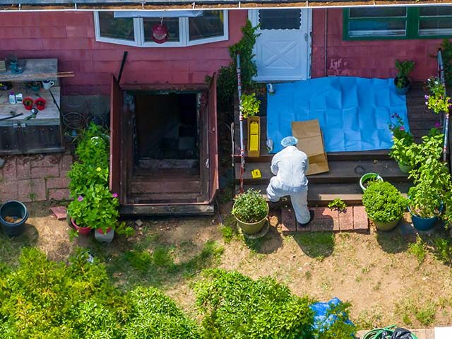 Massapequa Park, N.Y.: Police Investigator works in the backyard of Gilgo Beach murders su