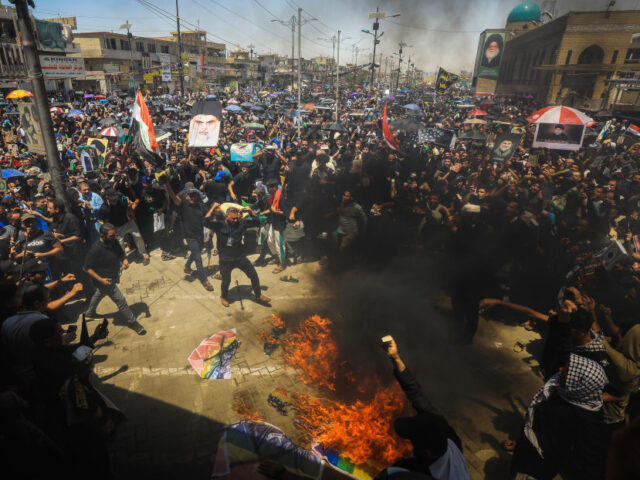 BAGHDAD, IRAQ - JULY 21: Followers of Shia cleric Muqtada al-Sadr protest against the act