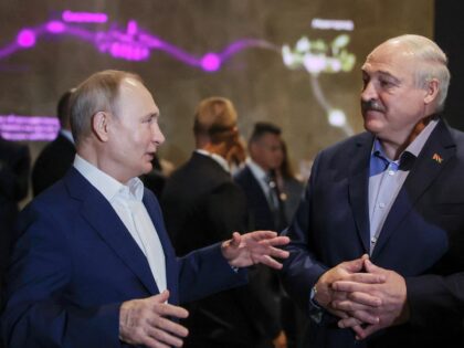 Russia's President Vladimir Putin (L) and Belarus' President Alexander Lukashenko (R) visi