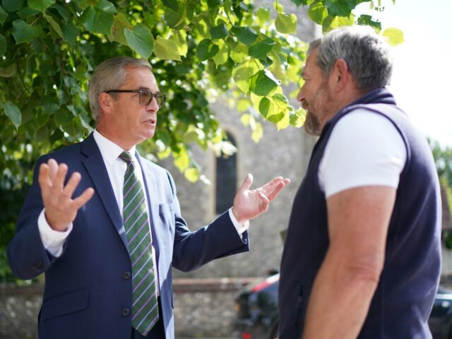 Former Ukip leader Nigel Farage talks to a resident while out near his home in Westerham, Kent, following the resignation of NatWest chief executive Dame Alison Rose after she admitted to being the source of an inaccurate story about Mr Farage's finances. Picture date: Wednesday July 26, 2023. (Photo by …