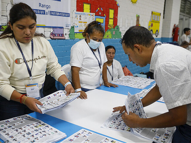 Officials count ballots at a polling station during the presidential election in Guatemala
