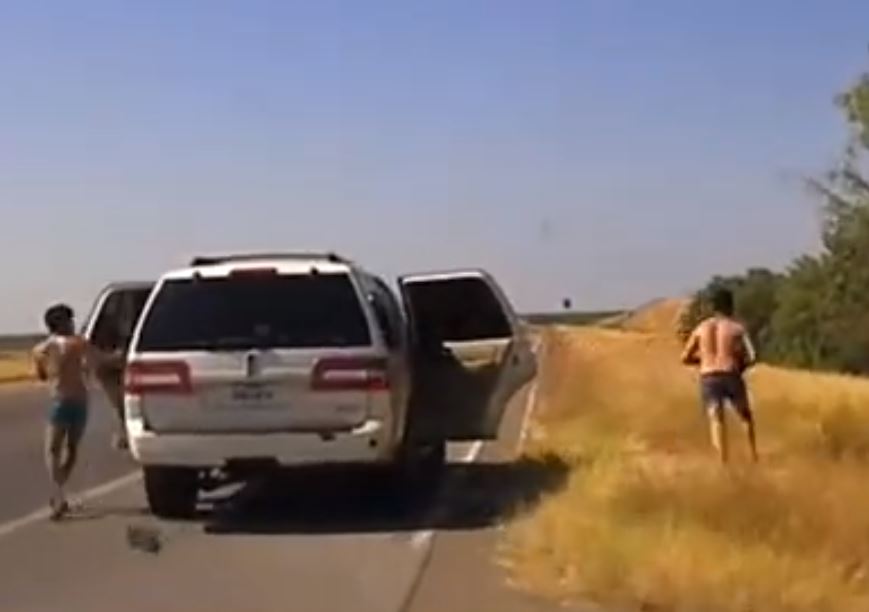Four migrants bail out of smuggler's vehicle during a police pursuit in Webb County, Texas. (Texas Department of Public Safety Video Screenshot)