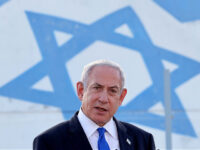 TOPSHOT - Israel's Prime Minister Benjamin Netanyahu delivers a speech during his visit to