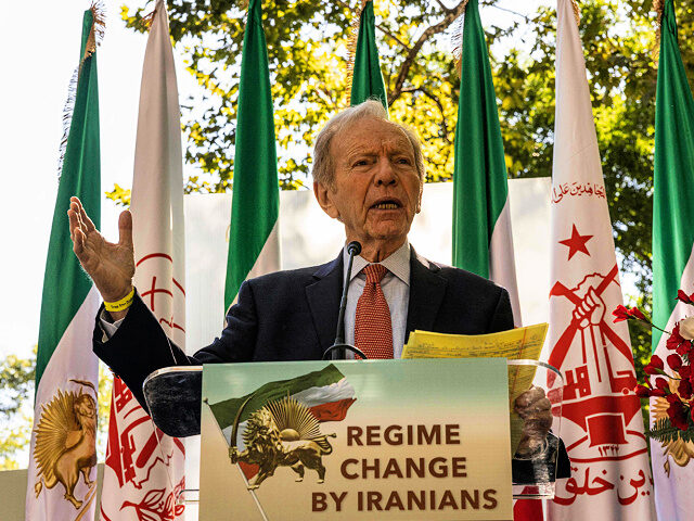 Former Connecticut Senator Joe Lieberman addresses a protest against Iranian President Ebr