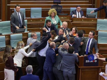 Lawmakers push each other as a brawl breaks out in Kosovo's parliament in Pristina, Kosovo, Thursday, July 13, 2023. A brawl erupted in the Kosovo parliament on Thursday after an opposition lawmaker threw water on Prime Minister Albin Kurti while he was speaking about government measures to defuse tensions with …