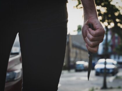 Man with knif on street