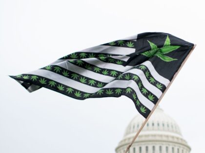 UNITED STATES - APRIL 24: A U.S. flag redesigned with marijuana leaves blows in the wind as DCMJ.org holds a protest in front of the U.S. Capitol on Monday, April 24, 2017, to call on Congress to reschedule the drug classification of marijuana. (Photo By Bill Clark/CQ Roll Call)