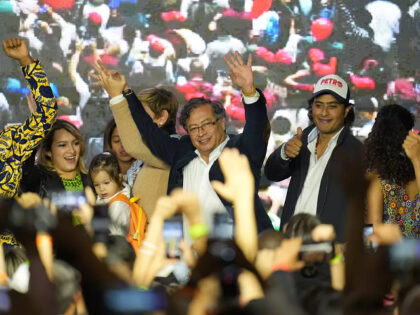 FILE - Presidential candidate Gustavo Petro, center, waves to supporters alongside his fam