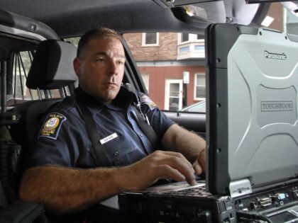 Gabe Souza/Staff Photographer: Patrolman Danny Rose of the Portland Police examines his Mo