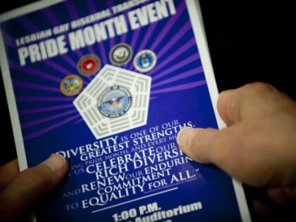 Close up of hands holding a pamphlet at the Pentagon during a Lesbian, Gay, Bi-Sexual, and