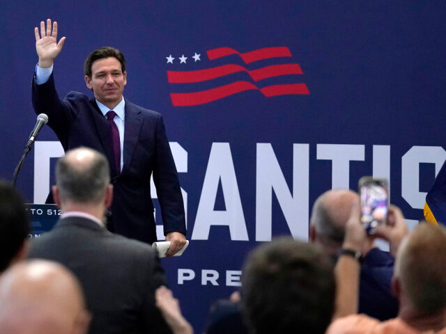 Republican presidential candidate Florida Gov. Ron DeSantis waves to guests during a campa