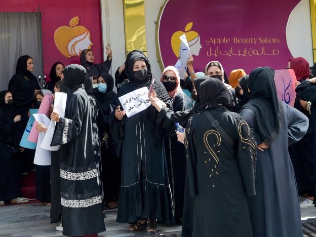 Afghan women stage a protest for their rights at a beauty salon in the Shahr-e-Naw area of